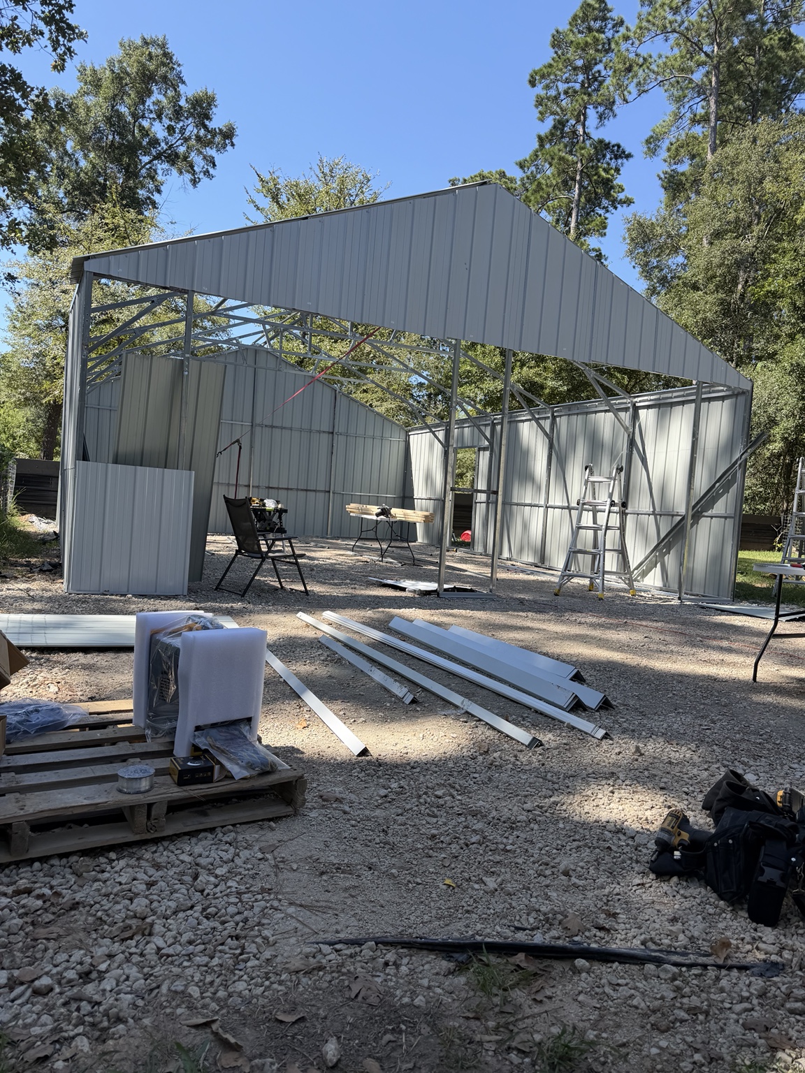 Metal building frame and wall panels during construction